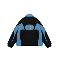 The COLLEC Signature '3' Sherpa Fleece Jacket in black and blue with bold vintage design and plush texture, ideal for cozy activewear fashion.